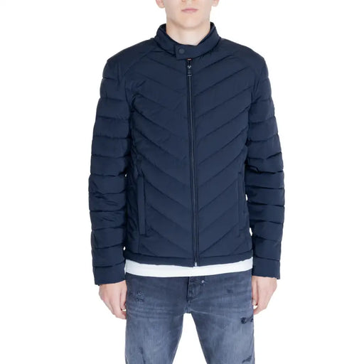 Navy blue quilted puffer jacket displayed in a product listing