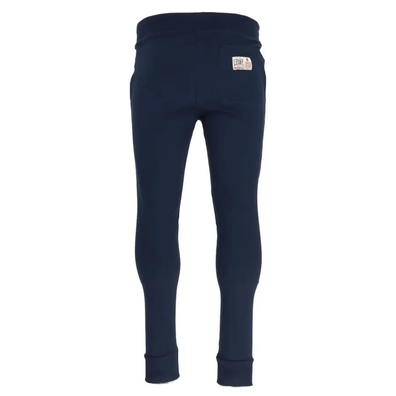 Navy blue cotton sweatpants shown from the back with a white label on the waistband for casual wear