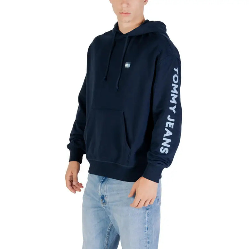 Navy blue Tommy Jeans hoodie displayed, stylish and comfortable casual wear