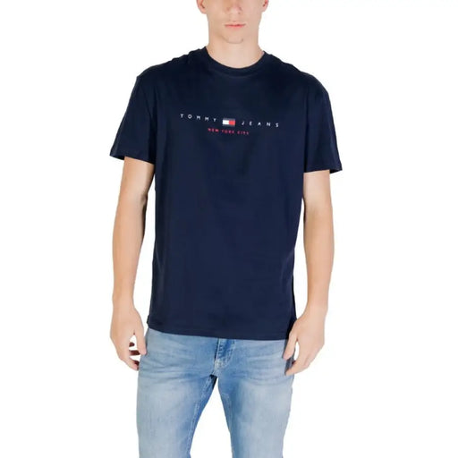 Navy blue Tommy Jeans T shirt displayed in a product image