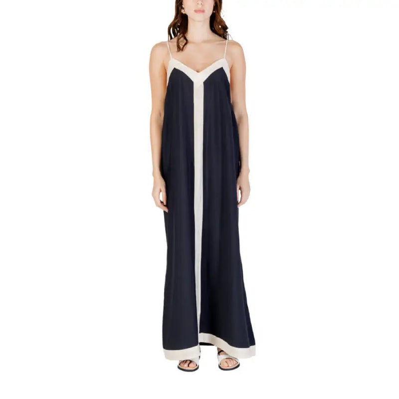 Navy and white sleeveless floor-length dress with dark trim, ideal for formal occasions