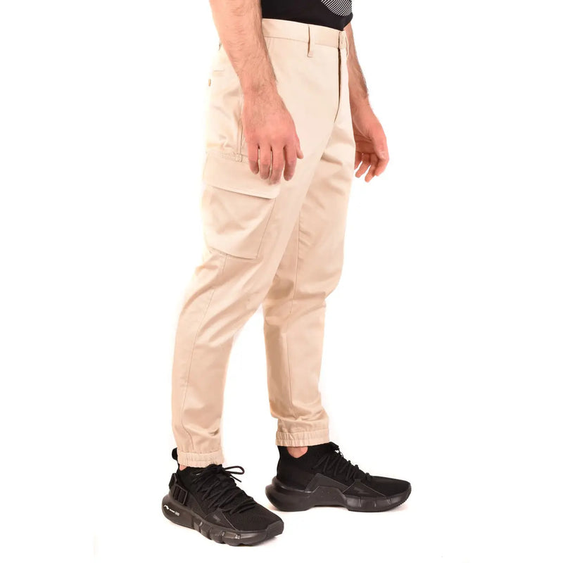 Neil Barrett men beige cotton trousers featuring cargo style with multiple pockets and tapered leg design
