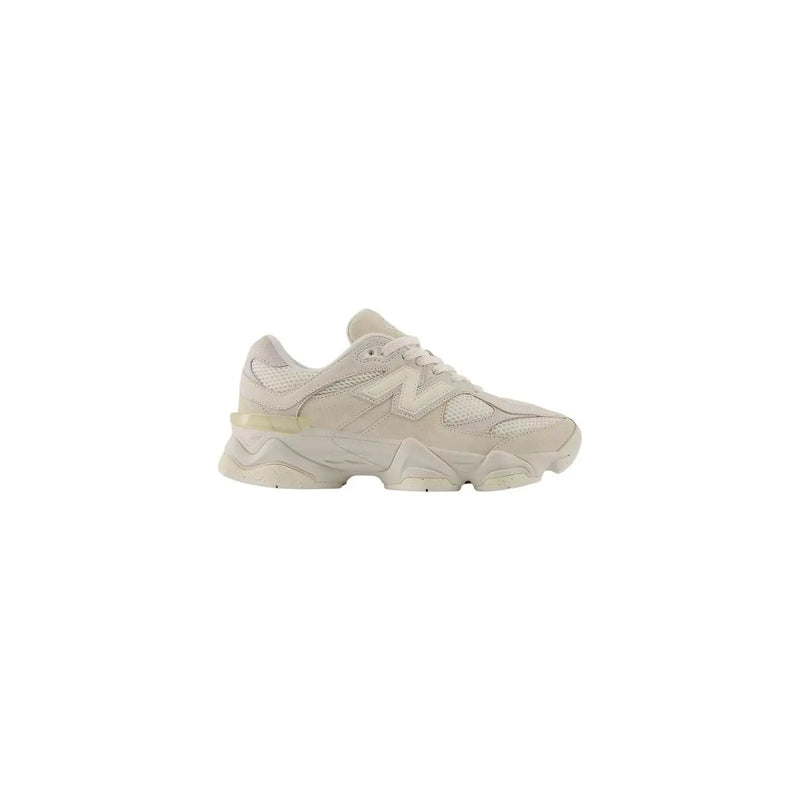 New Balance women beige suede sneakers featuring cream-colored 990v4 with chunky textured sole and mesh upper