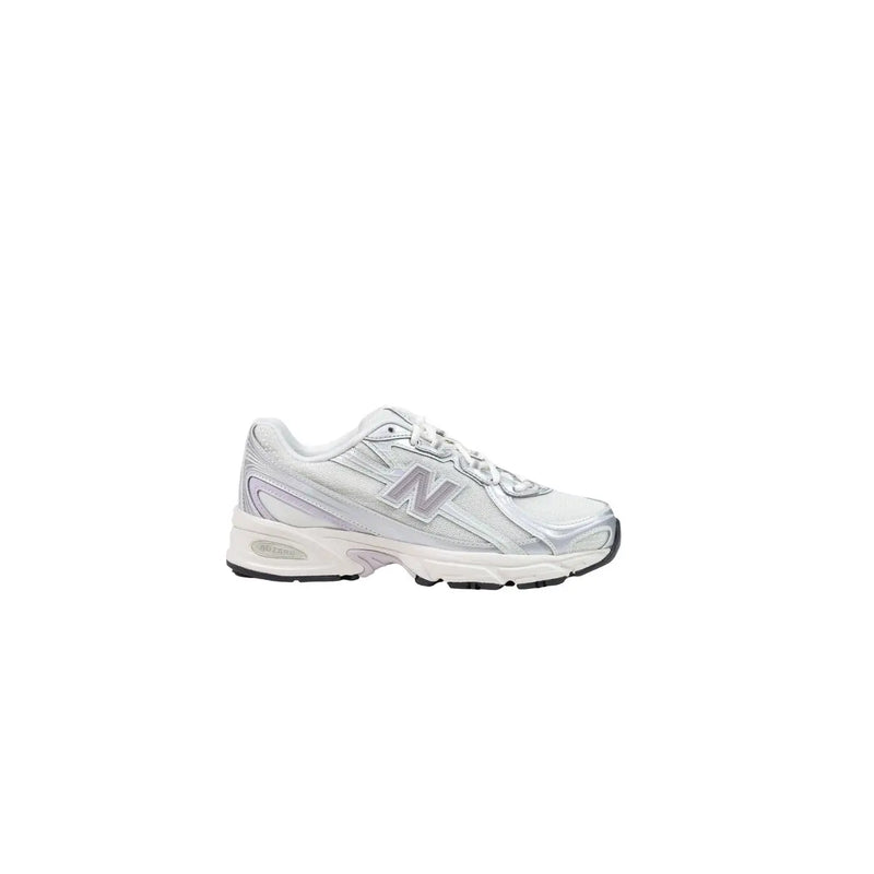 Silver new balance women running shoe with sleek modern design and white accents in synthetic slip-on style