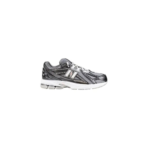 New Balance women’s black synthetic sneakers with gray mesh upper and cushioned sole