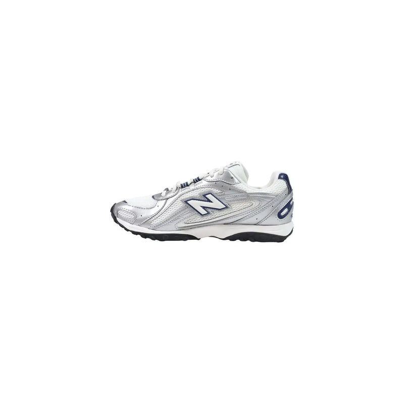 New Balance women blue slip on synthetic sneakers with silver and white mesh upper and black sole with navy heel accents