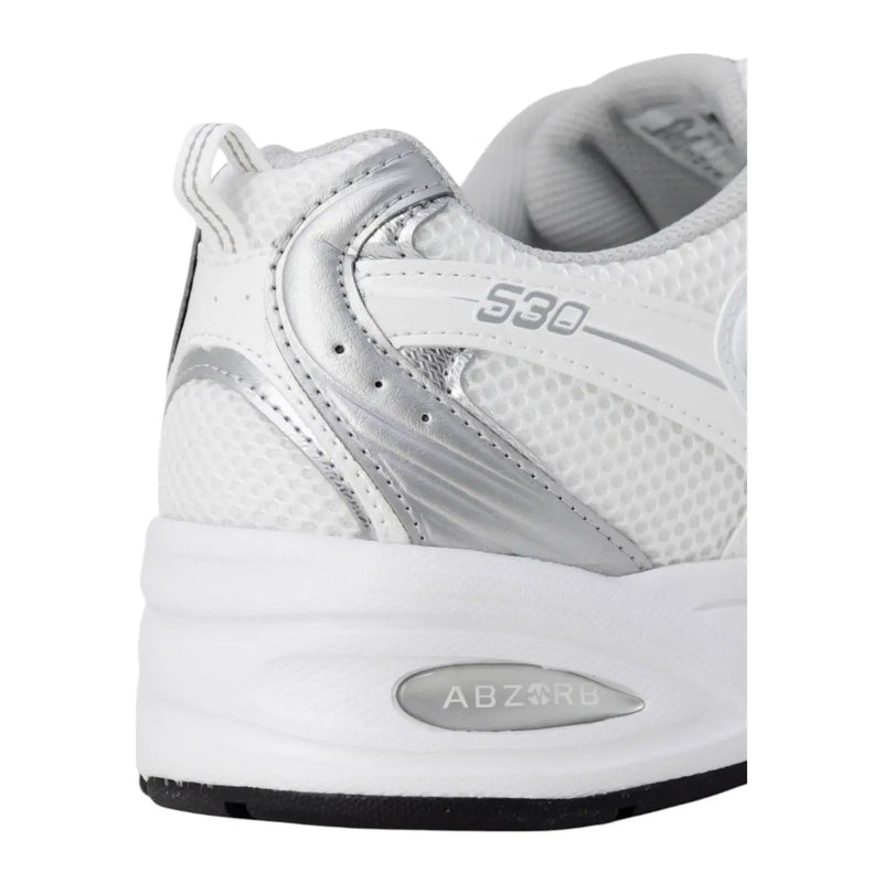 New Balance women grey faux leather sneakers with white and silver mesh upper, metallic accents, and 530 branding on side