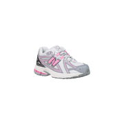 New Balance women grey slip on textile skate sneakers in white and gray with pink accents on laces logo and midsole