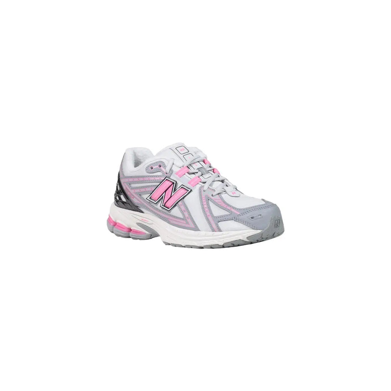 New Balance women grey slip on textile skate sneakers in white and gray with pink accents on laces logo and midsole