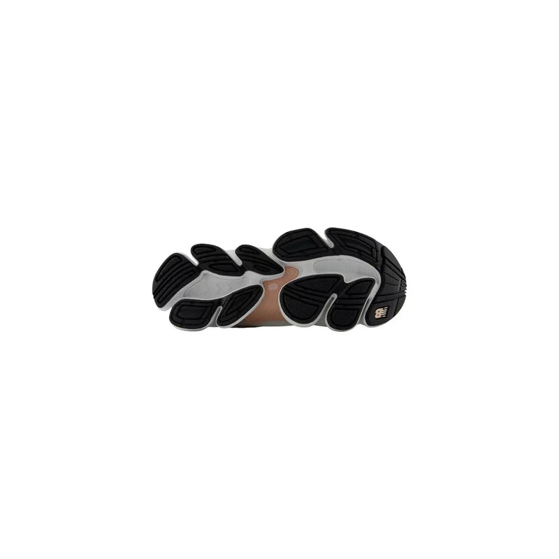 New Balance women grey sneakers with black and silver chunky sole and distinctive segmented textile synthetic design
