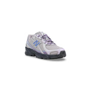 New Balance women lilac synthetic sneakers with light purple mesh upper gray accents blue logo and black rubber sole