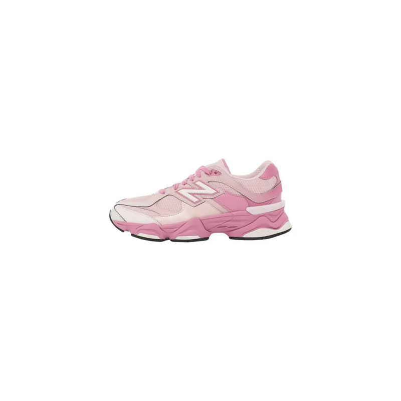New balance women pink suede sneakers with chunky layered sole in pink and white color scheme displayed from the back side