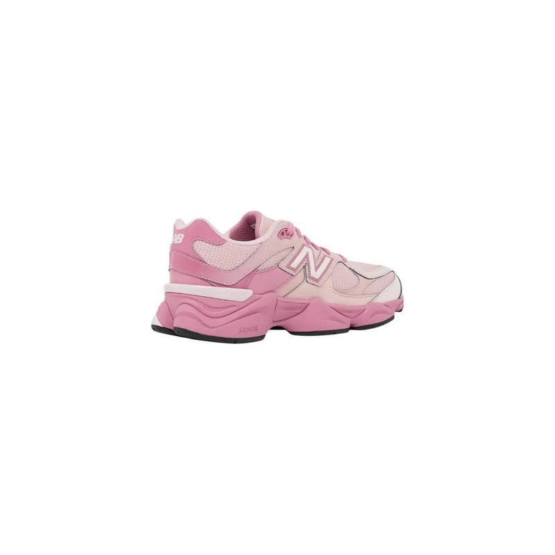 New balance women pink suede sneakers featuring mesh and synthetic overlays in a pink 990v5 sneaker design