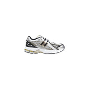 New Balance women silver synthetic sneakers in white and black with silver accents and visible air cushioning unit