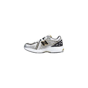 New Balance women silver synthetic sneakers with mesh upper, black and gold accents, and white midsole running shoes