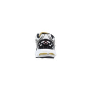 New Balance women silver synthetic sneakers white and black running shoe with gold accents on heel and midsole back view