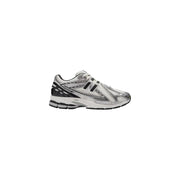 New Balance women silver slip on skate sneakers with black mesh upper and rubber sole designed for casual wear
