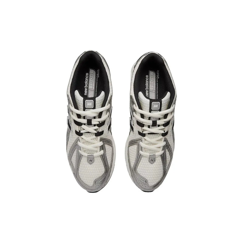 New Balance women silver textile slip on skate sneakers with white and black mesh uppers and silver accents