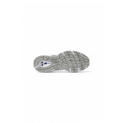 Gray and white textured sole of new balance women white faux leather sport sneakers shown from the back side