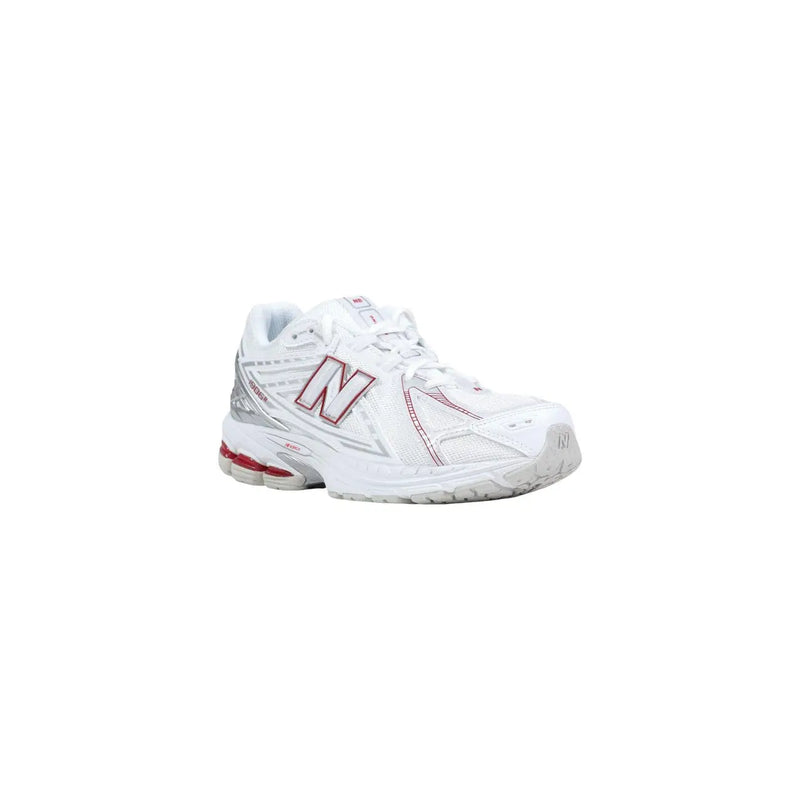New balance women white synthetic running shoe with pink and silver accents displayed from the front