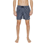 Navy blue Nike men’s swim trunks with white wavy pattern black drawstring waistband 100 percent polyester
