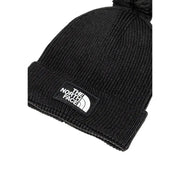 Black beanie with pom-pom and the north face logo.
