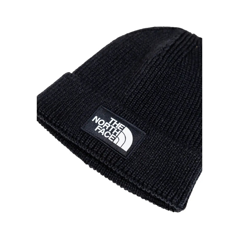 Schwarze, gerippte Strickmütze von The North Face für Herren mit weißem, gesticktem Logo-Patch auf dem umgeschlagenen Schirm (Vorderansicht).