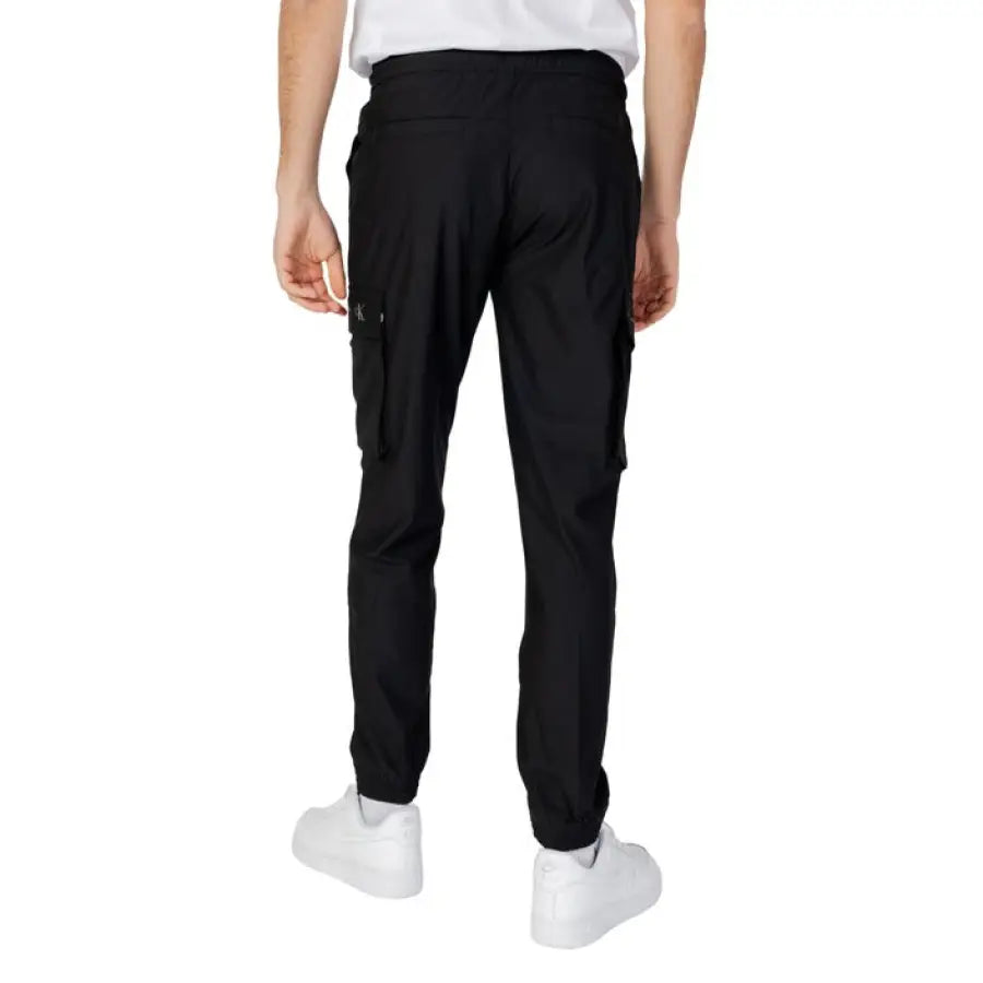 
                      
                        Calvin Klein Jeans Men Trousers featuring stylish The North Face cargo pants
                      
                    