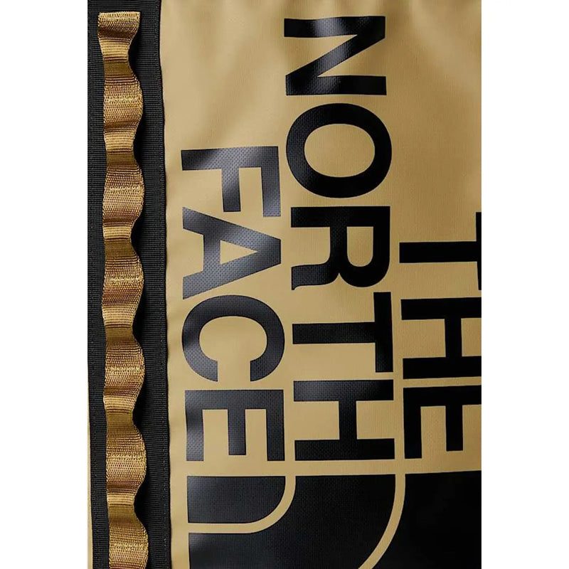 The North Face Herren-Rucksack in Beige mit Print, goldfarbener schwarzer Schrift und wellenförmigem goldenen Zierstreifen an der Seite