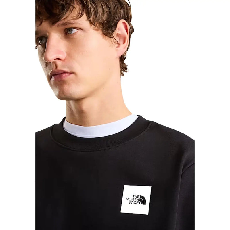 Schwarzes North Face Herren-Sweatshirt aus Baumwolle in regulärer Passform mit weißem, rechteckigem Logo-Patch auf der Brust