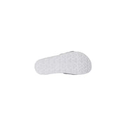 Die North Face Herren-Slipper mit weißem Logoprint verfügen über eine weiße Gummisohle mit geometrischem Profil und schwarzem Besatz.