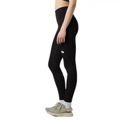 Schwarze, hochgeschnittene Leggings von The North Face für Damen aus Polyester-Elastan mit dezentem weißen Logo am Oberschenkel.