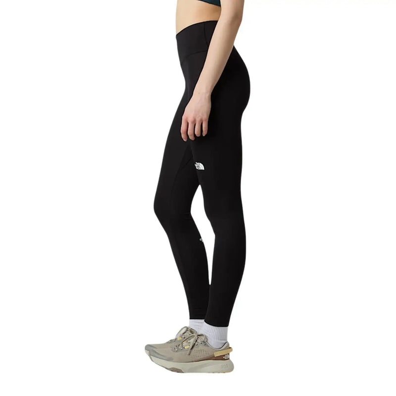 Schwarze, hochgeschnittene Leggings von The North Face für Damen aus Polyester-Elastan mit dezentem weißen Logo am Oberschenkel.