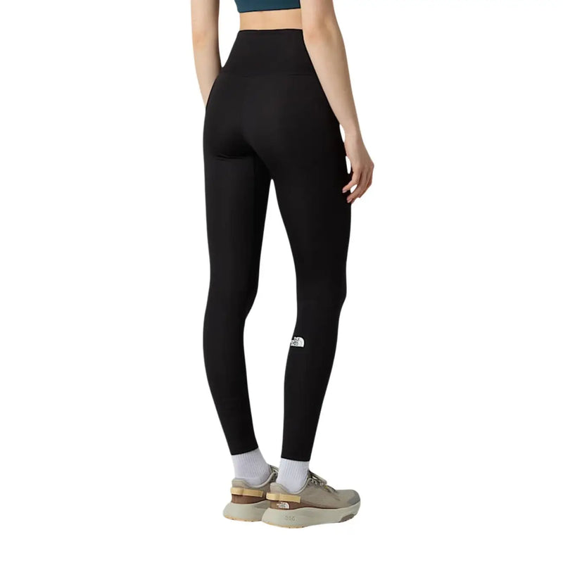 Schwarze, hochgeschnittene Leggings von The North Face für Damen aus Polyester-Elastan mit weißem Logo am linken Oberschenkel