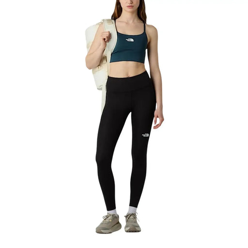 Schwarze Leggings mit hohem Bund und weißem Logo am linken Oberschenkel aus Polyester-Elastan von The North Face (Damenhose)