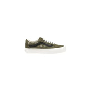 Olive green Vans Women Sneakers in leather with laces displayed on a neutral background