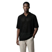 Only & sons Schwarzes Herren-Poloshirt aus Bio-Baumwolle mit V-Ausschnitt und kurzen Ärmeln, mit strukturiertem, durchbrochenem Muster auf Brust und Schultern.