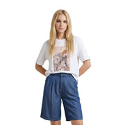 White cotton round neck t shirt in beige by only women featuring a stylized graphic print on the front worn by a model