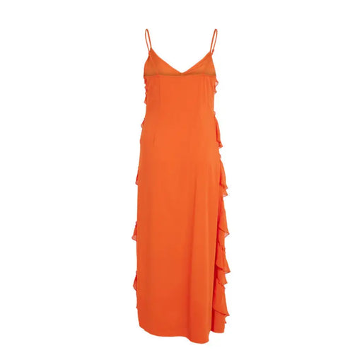 Orange ruffled spaghetti strap maxi dress displayed on a mannequin with flowing ruffles