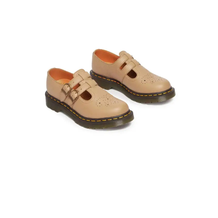 
                      
                        Tan Dr. Martens women shoes with buckle feature
                      
                    