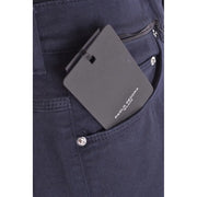 Black rectangular paolo pecora milano tag on the back pocket of dark blue cotton stretch denim trousers for men