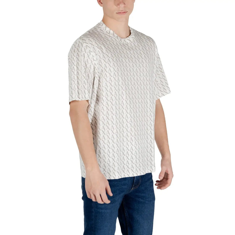 A white short sleeve t shirt with a gray repeating geometric pattern worn by a model