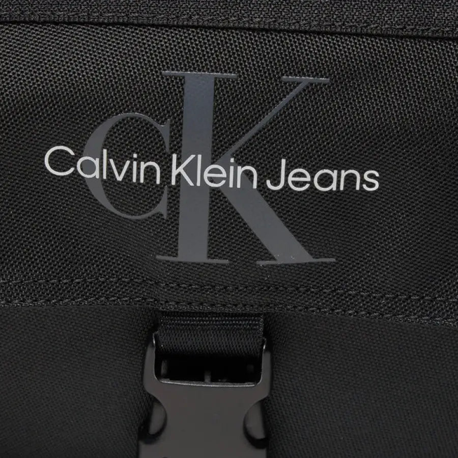 
                      
                        Calvin Klein men bag in black showcasing urban city fashion
                      
                    