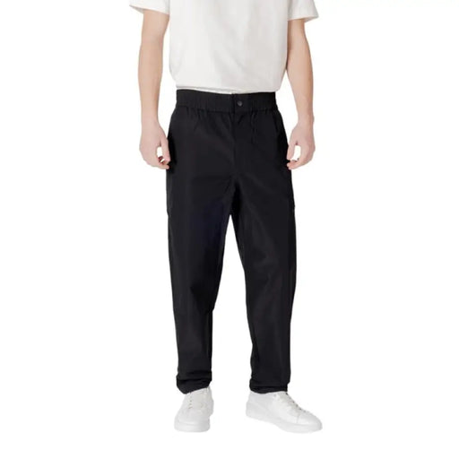 Person wearing Black Athletic Cargo Pants and white shoes demonstrating style and comfort