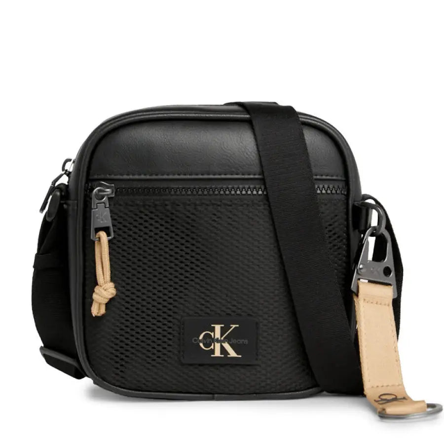 Calvin Klein men bag in urban style setting, showcasing sleek camera bag for city fashion