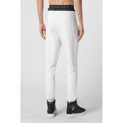 White Philipp Plein men joggers with black elastic waistband featuring logo and matching side stripes