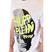 White Philipp Plein men t-shirt with bold skull graphic half silver sequins half black and neon yellow lettering 1978 below