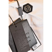 Black hexagonal brand tag with silver interlocking pp logo on philipp plein men t shirt