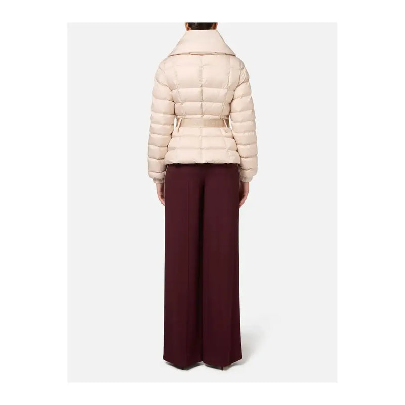 Women wearing a belted cream puffer jacket with wide-leg burgundy trousers by Elisabetta Franchi