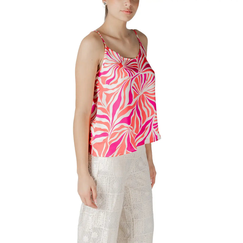 Pink polyester v neck strap top for women with vibrant pink and white abstract leaf pattern and spaghetti straps